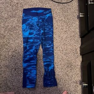 Blue patterned Nike leggings. Size XS, but could fit child size.